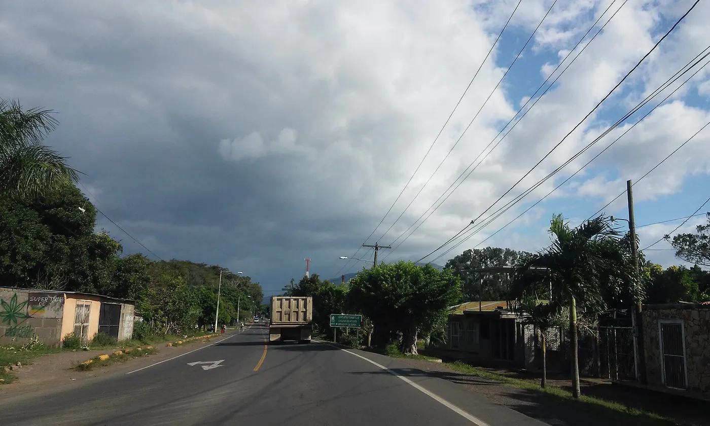 Green hills with the Mombacho volcano on the horizon